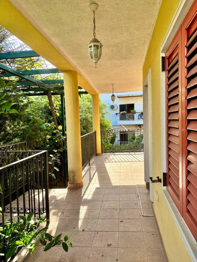 Đenovići house covered terrace with iron railing