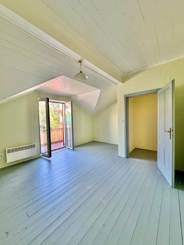 Đenovići house attic bedroom with balcony doors