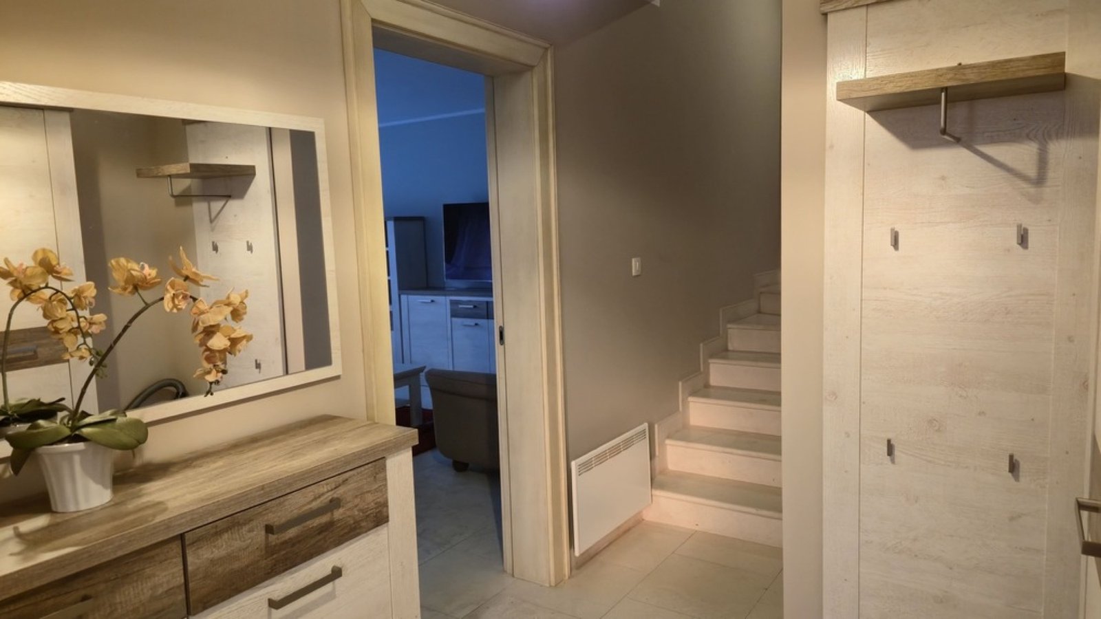 Lastva House entry hallway with stairs and coat panel