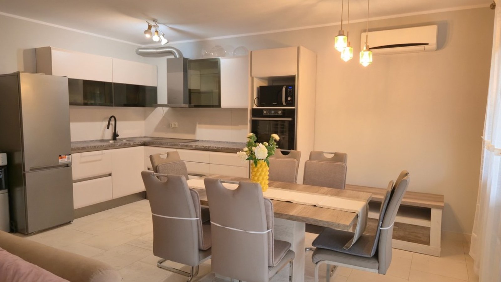 Lastva House living room with sofas and TV unit
