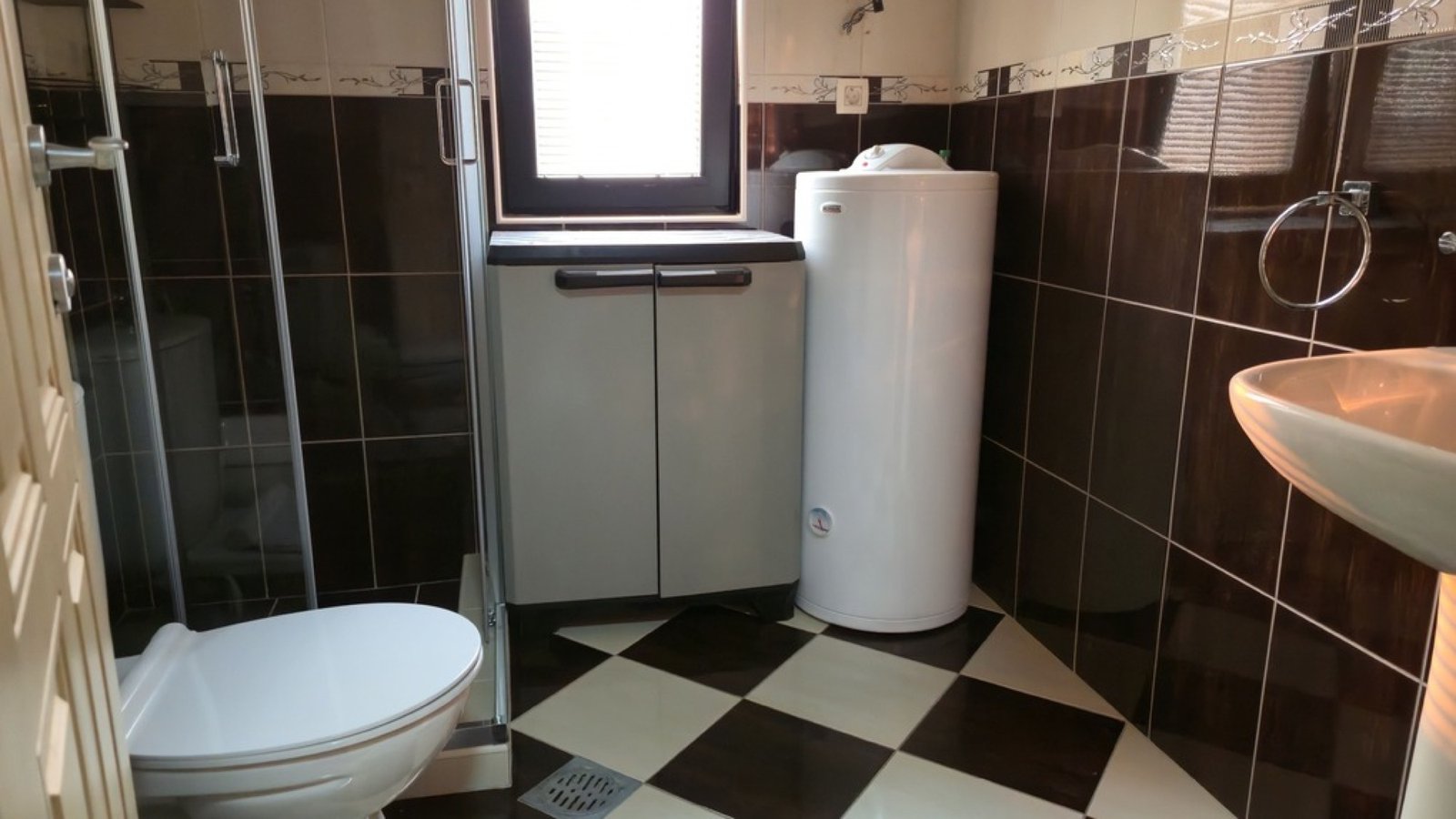 Lastva House bathroom with shower and boiler